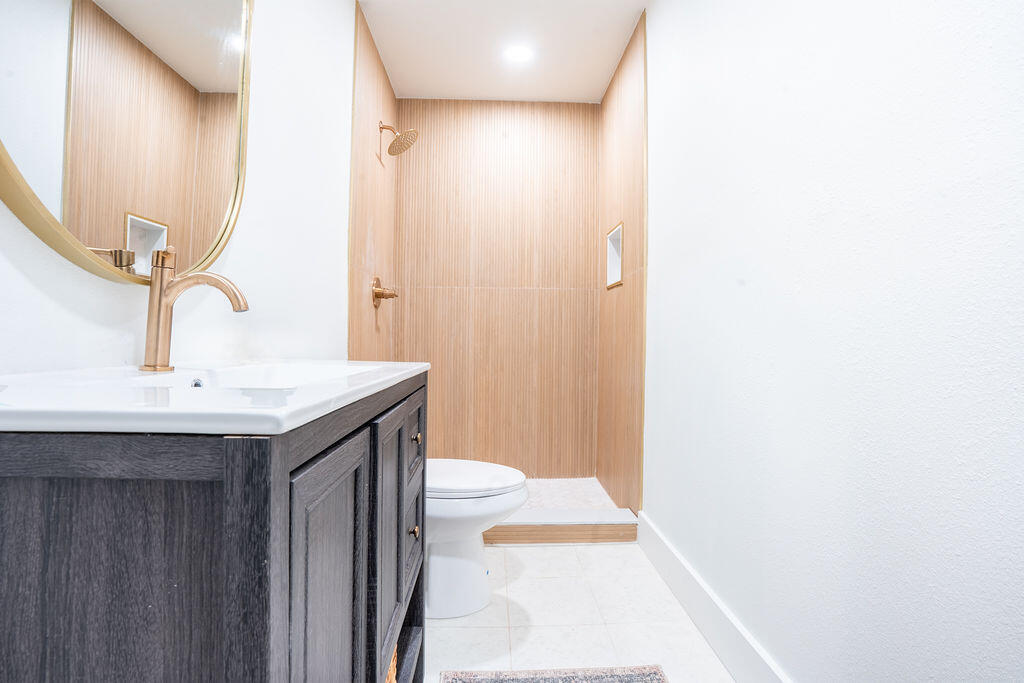 1011 Creel Street Fort Walton Beach, FL 32547 - Photo 14 of 30 a bathroom with a sink and a mirror