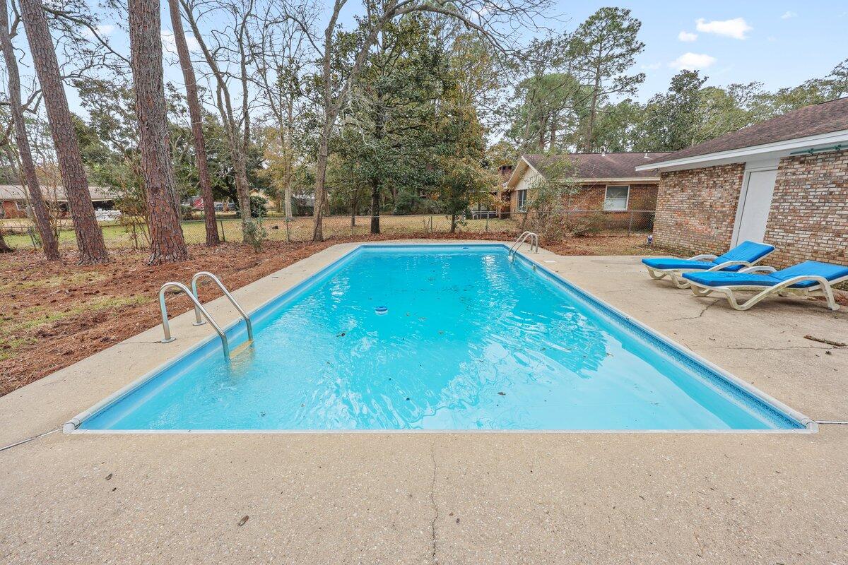 1011 Creel Street Fort Walton Beach, FL 32547 - Photo 25 of 30 a view of a backyard with swimming pool