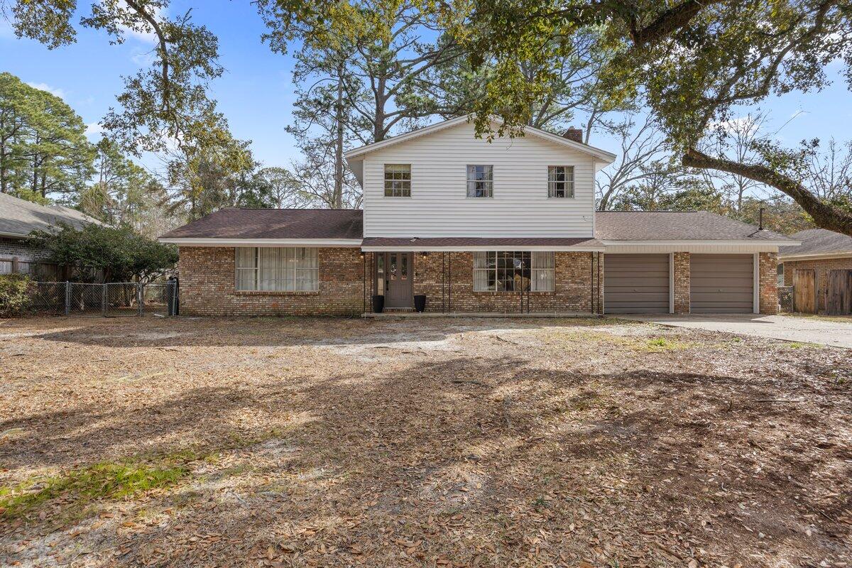 1011 Creel Street Fort Walton Beach, FL 32547 - Photo 27 of 30 a front view of a house with a garden