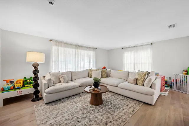 a living room with furniture and a couch