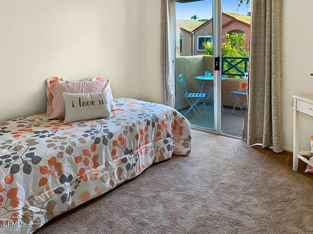 1217 Nautical Way Oxnard, CA 93030 - Photo 11 of 15 a bedroom with a bed and a painting on the wall