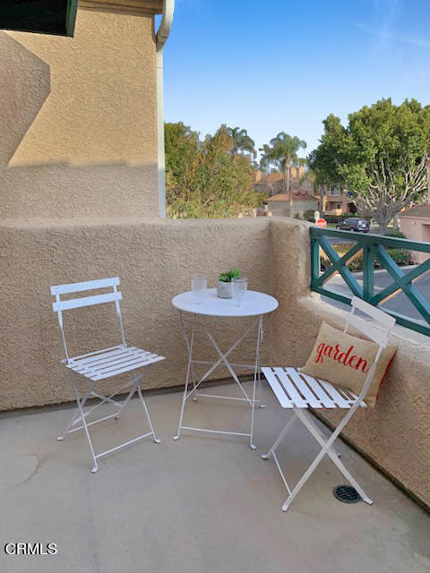 1217 Nautical Way Oxnard, CA 93030 - Photo 14 of 15 a balcony with a table and a chair