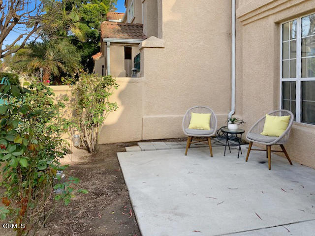 1217 Nautical Way Oxnard, CA 93030 - Photo 15 of 15 a backyard of a house with table and chairs