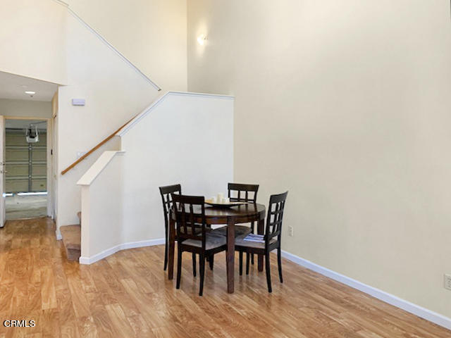 1217 Nautical Way Oxnard, CA 93030 - Photo 4 of 15 a view of a dining room with furniture and wooden floor