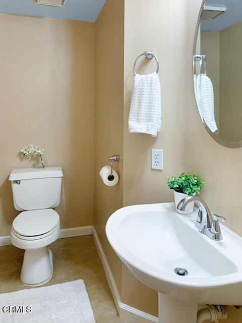 1217 Nautical Way Oxnard, CA 93030 - Photo 7 of 15 a bathroom with a sink and a toilet