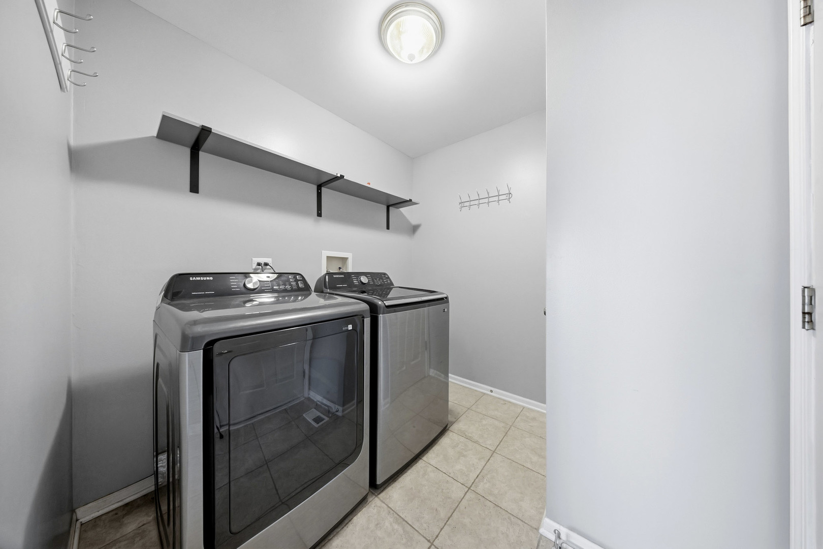 548 Arbor Lane Oswego, IL 60543 - Photo 16 of 46 a utility room with dryer and washer