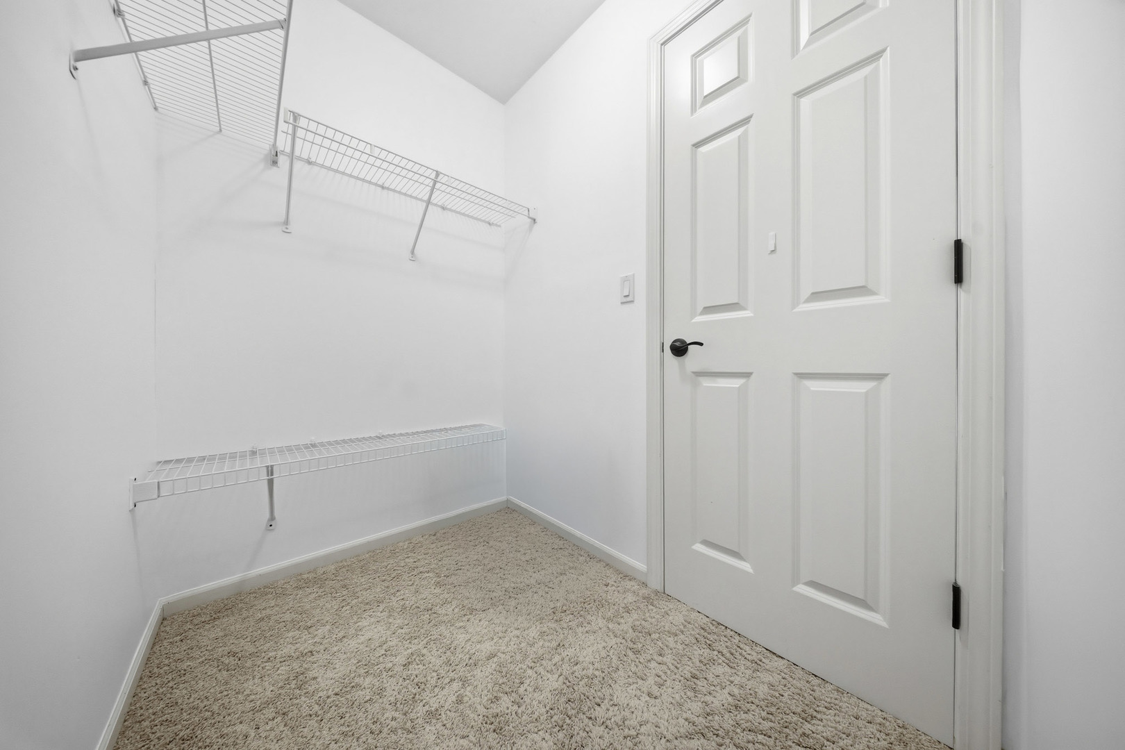 548 Arbor Lane Oswego, IL 60543 - Photo 24 of 46 a view of a room with racks on the wall