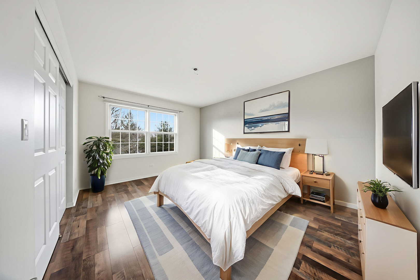 548 Arbor Lane Oswego, IL 60543 - Photo 27 of 46 a spacious bedroom with a bed and a flat screen tv