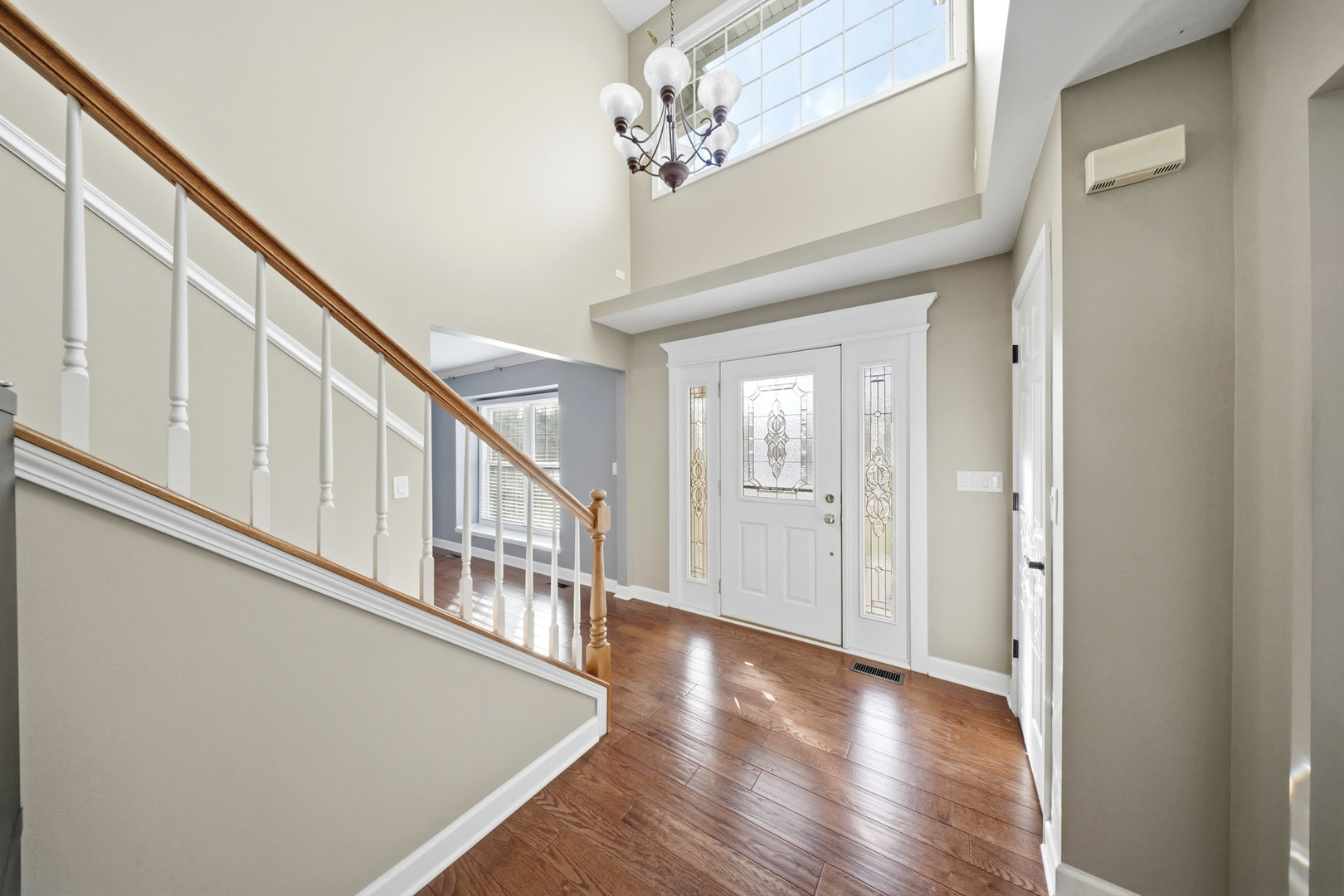 548 Arbor Lane Oswego, IL 60543 - Photo 3 of 46 a view of an entryway with wooden floor