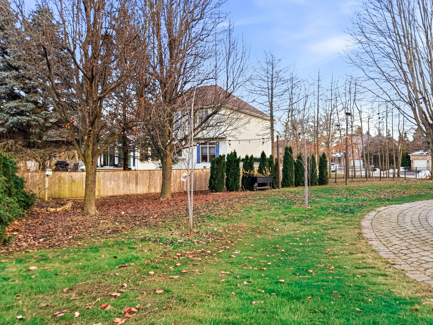 548 Arbor Lane Oswego, IL 60543 - Photo 40 of 46 a backyard of apartments with large trees