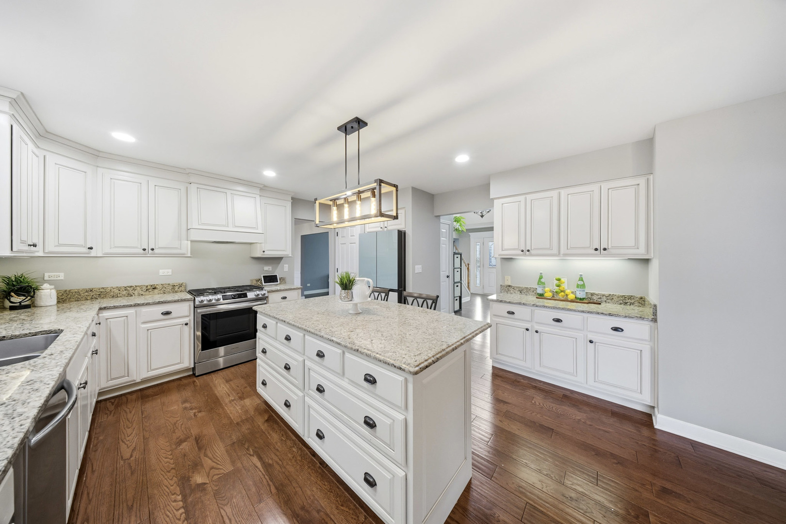 548 Arbor Lane Oswego, IL 60543 - Photo 10 of 46 a kitchen with stove cabinets and wooden floor