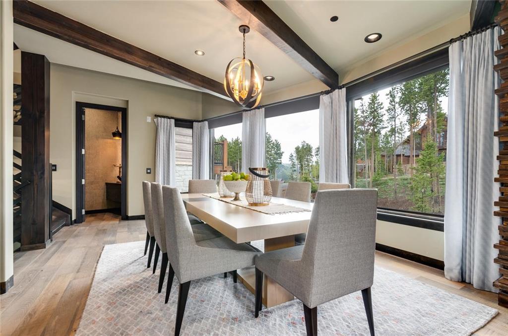 284 Timbertrail Road Breckenridge, CO 80424 - Photo 8 of 35 a dining room with furniture a chandelier and wooden floor