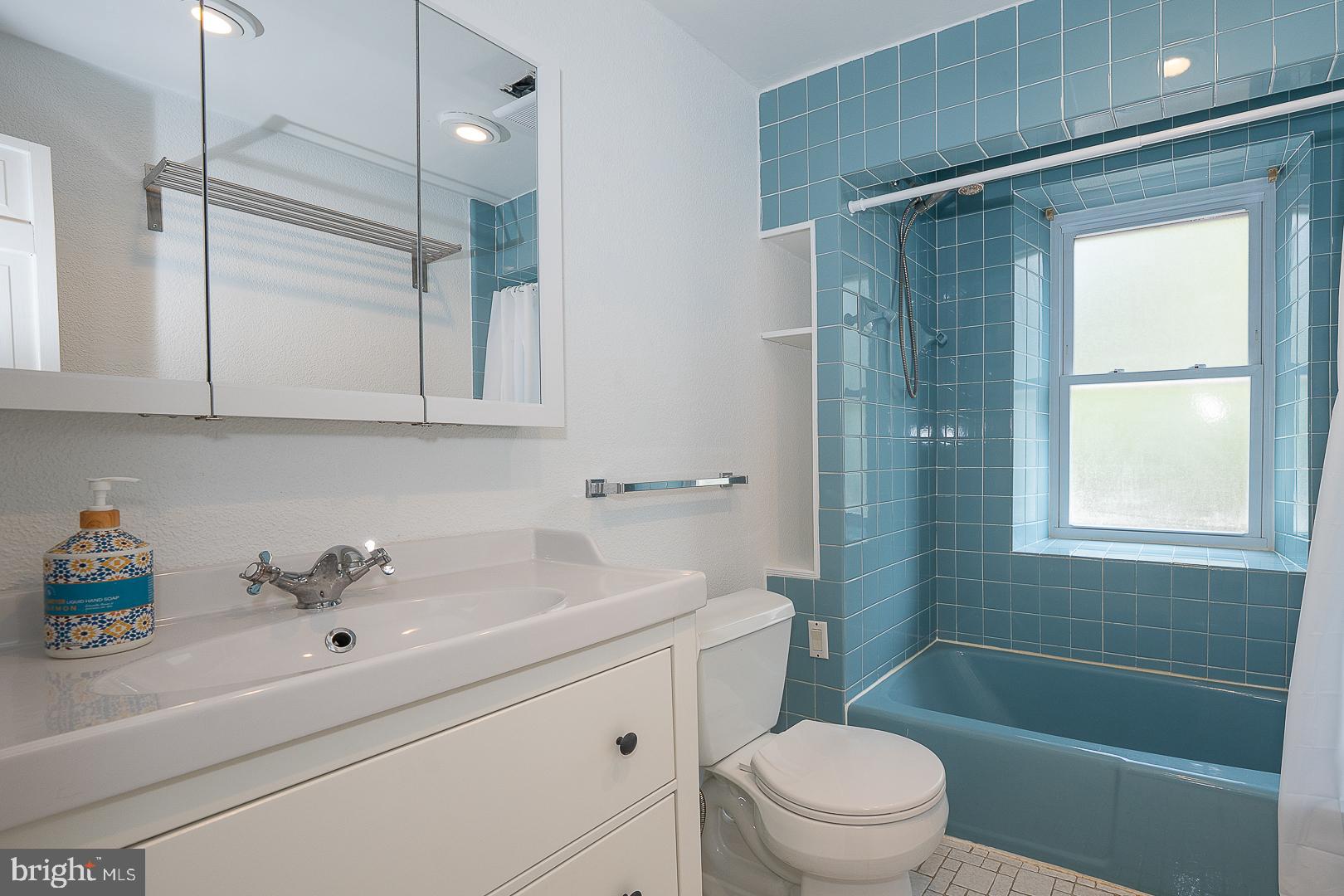 312 Highland Road Cheltenham, PA 19012 - Photo 14 of 36 a bathroom with a sink a toilet and shower