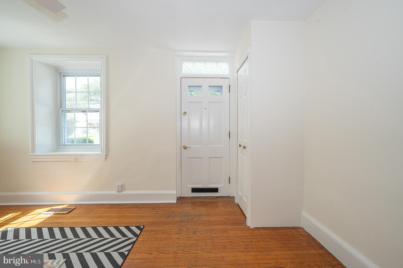 312 Highland Road Cheltenham, PA 19012 - Photo 4 of 36 a view of a room with wooden floor and windows