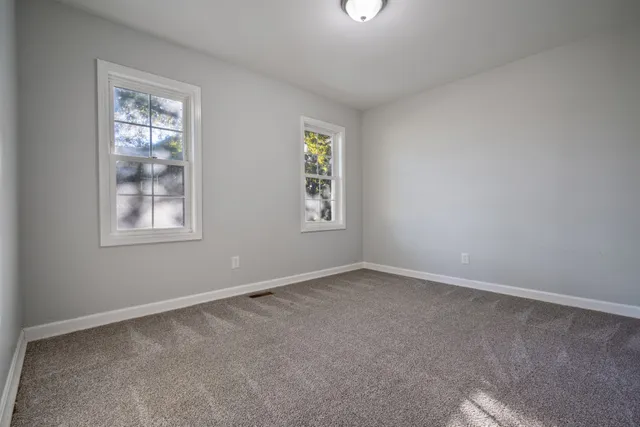 an empty room with windows