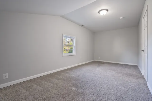 a view of a house with yard and a yard