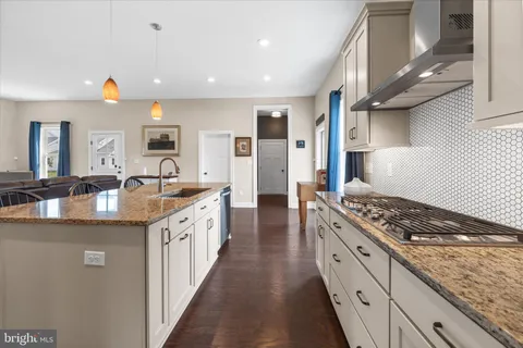 a bathroom with a sink toilet and a mirror