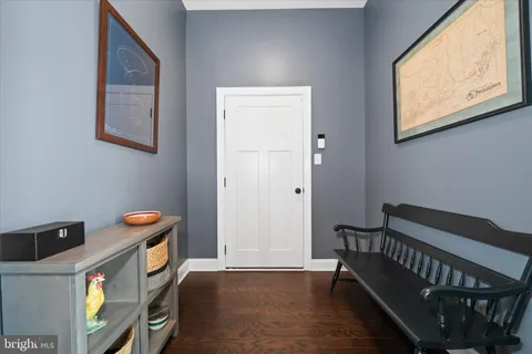 a view of walk in closet with clothes