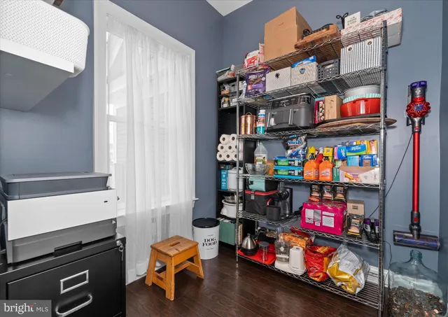 a view of walk in closet with clothes