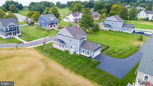 an aerial view of a house with a garden