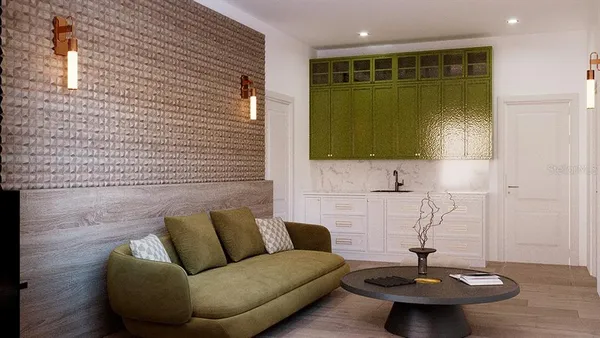 a living room with furniture and a potted plant