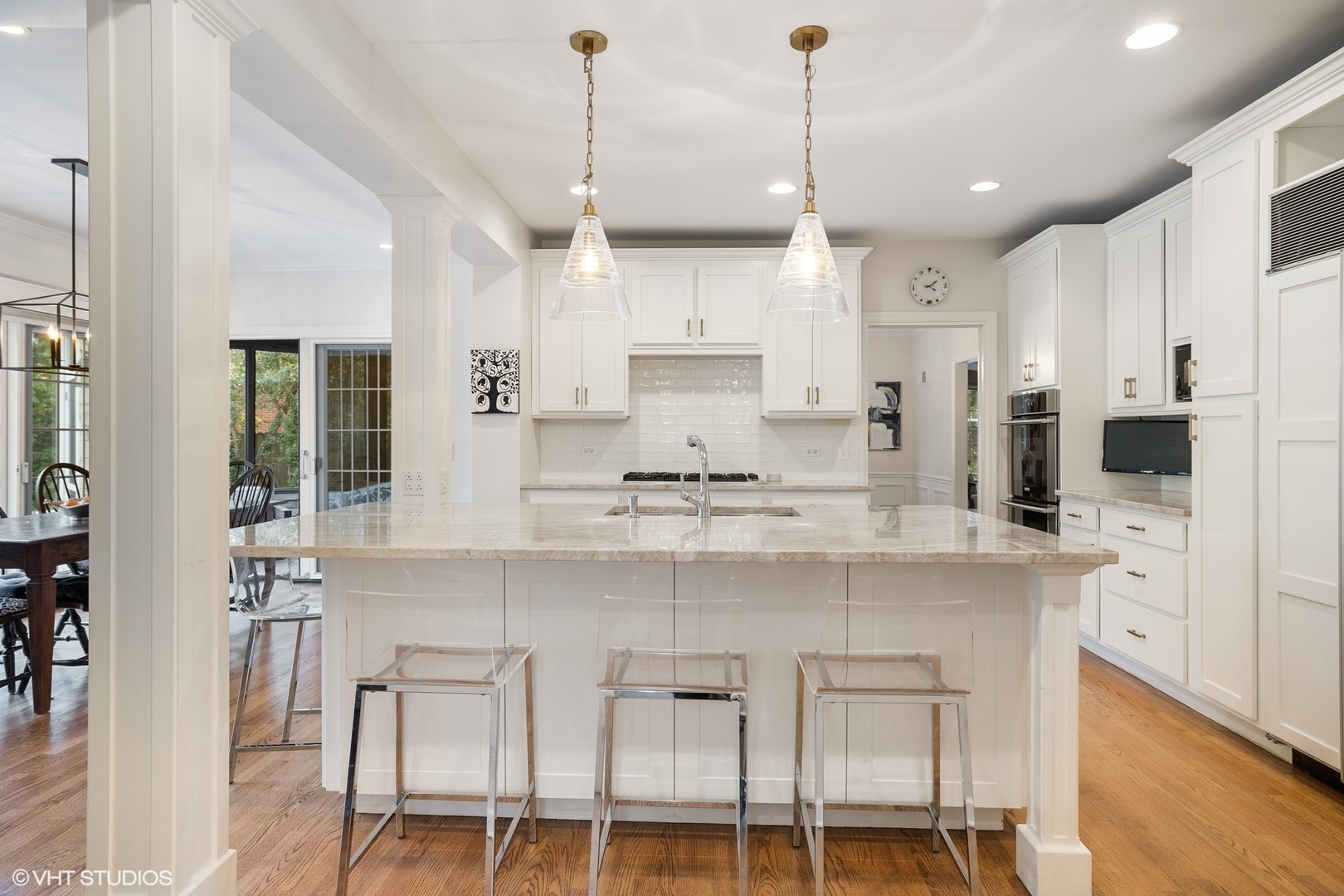 918 Locust Road Wilmette, IL 60091 - Photo 11 of 35 a kitchen with cabinets and chairs