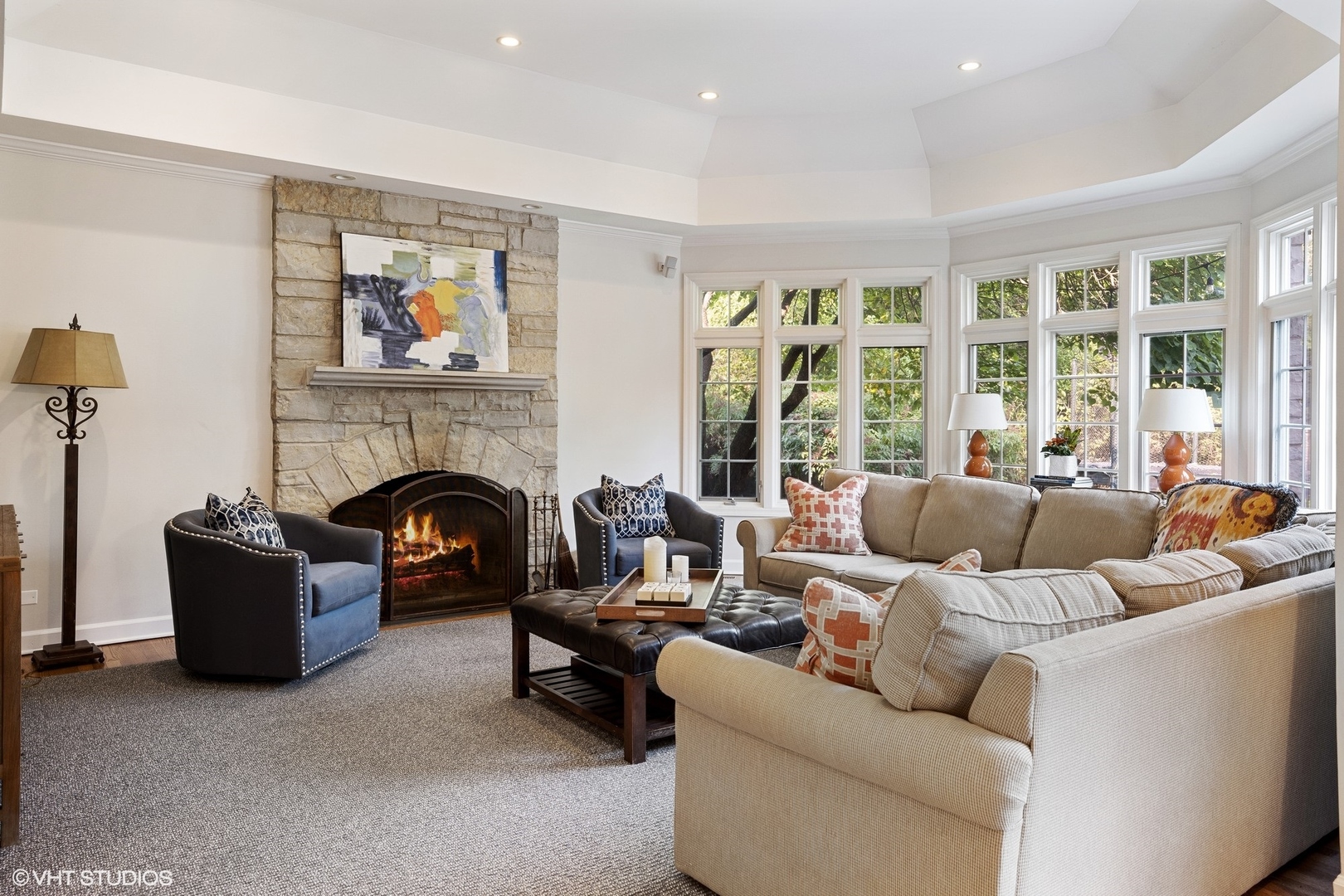 918 Locust Road Wilmette, IL 60091 - Photo 15 of 35 a living room with furniture large window and a fireplace