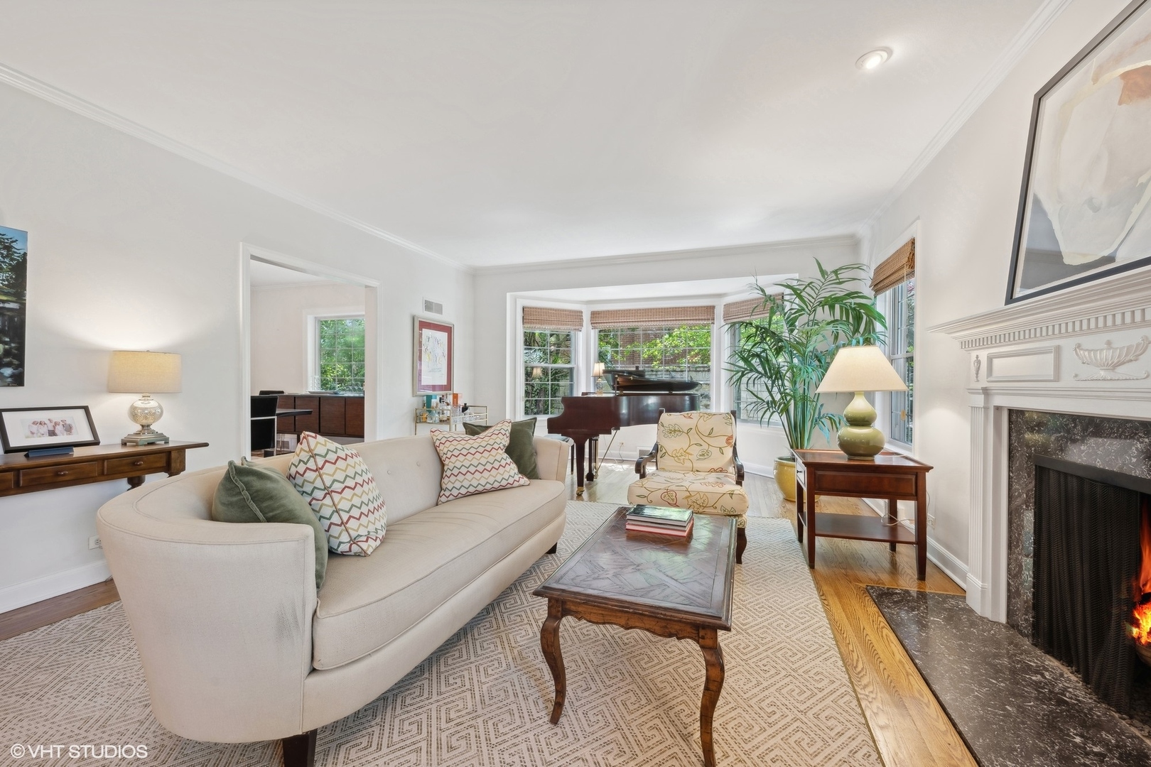 918 Locust Road Wilmette, IL 60091 - Photo 4 of 35 a living room with furniture fireplace and a large window