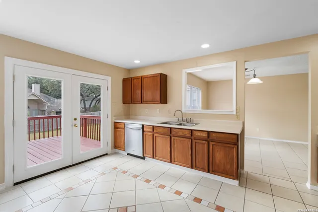 a large bathroom with a granite countertop sink and a mirror