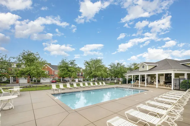 a view of a swimming pool with a patio