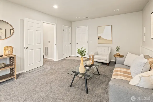 a living room with furniture and a window