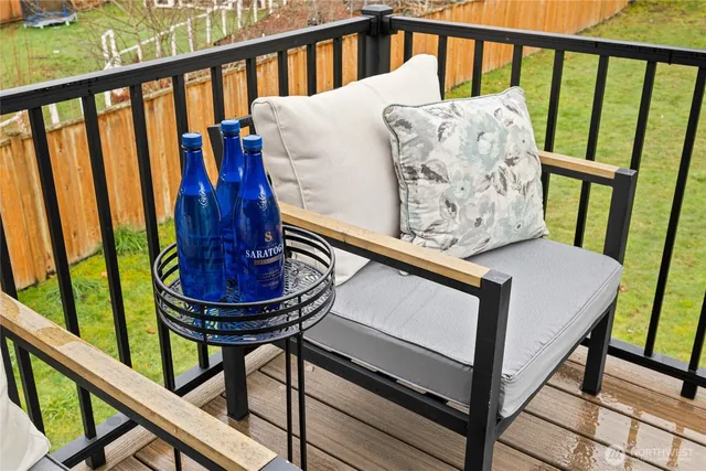 a view of a balcony with furniture