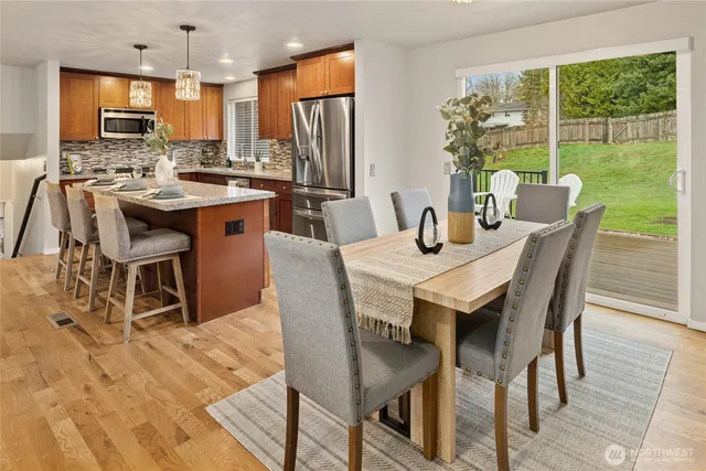 a view of a dining room with furniture window and outside view