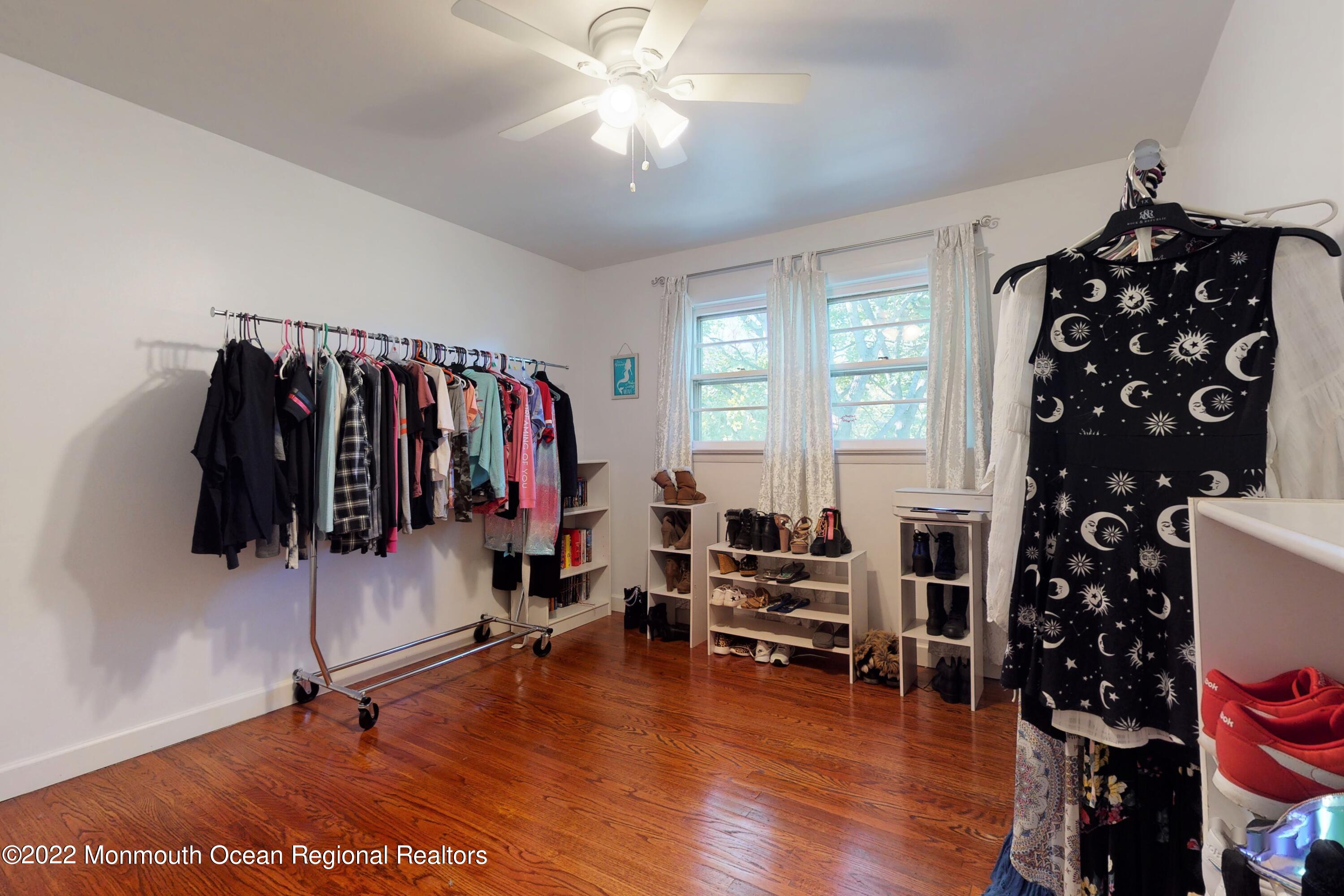 919 Monmouth Road Cream Ridge, NJ 08514 - Photo 13 of 27 a view of a room with wooden floor and windows