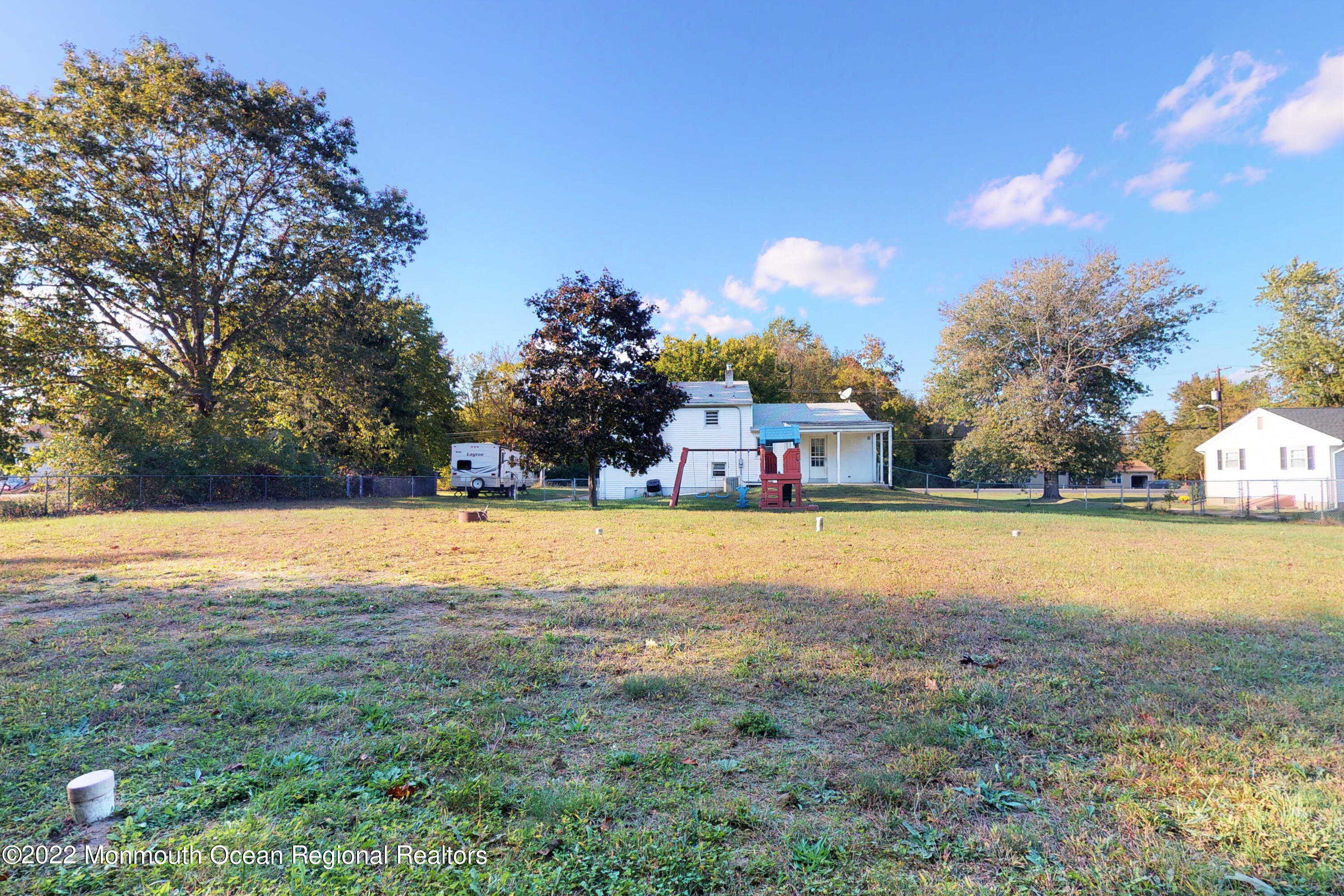 919 Monmouth Road Cream Ridge, NJ 08514 - Photo 25 of 27 a swimming pool with trees in the background