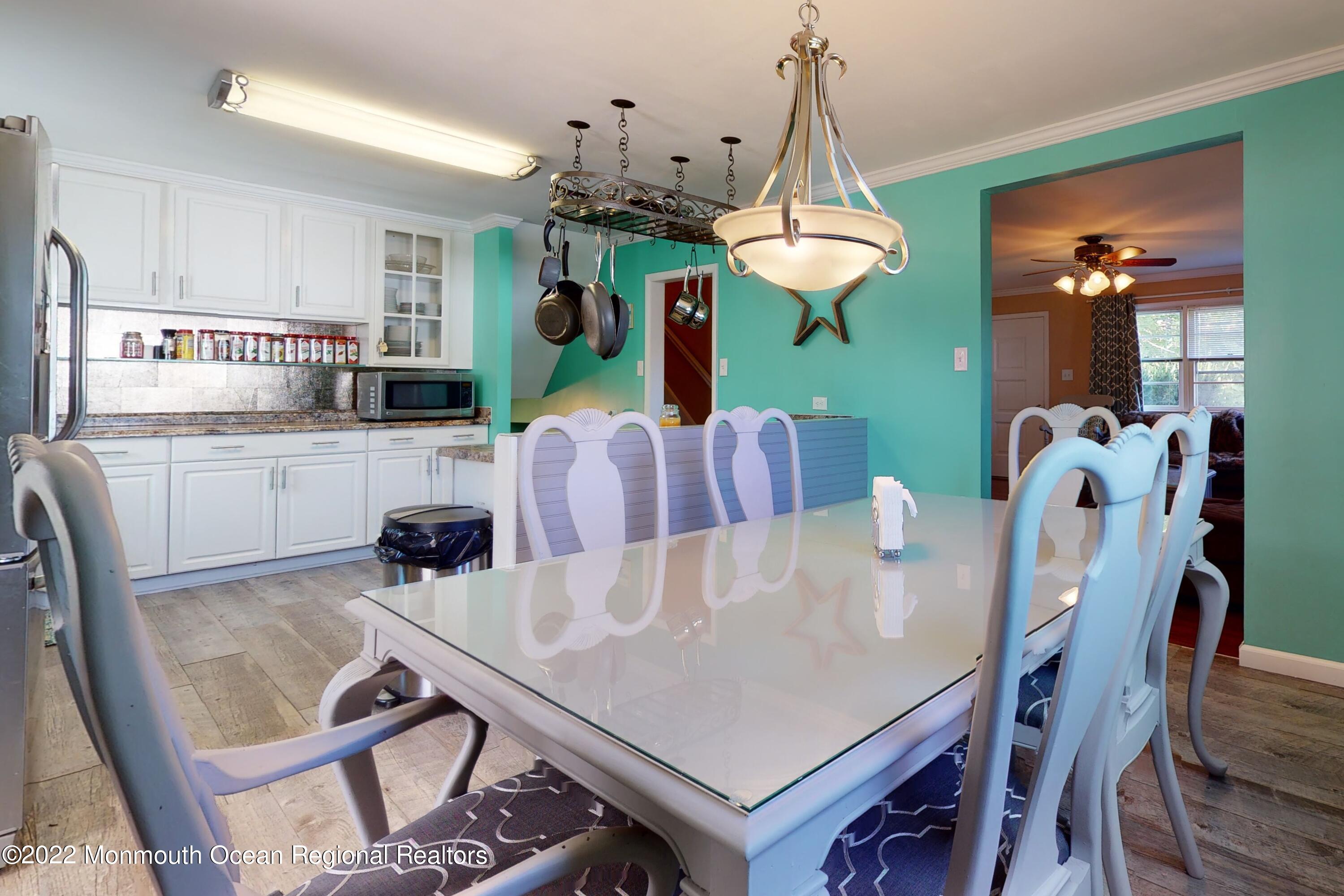 919 Monmouth Road Cream Ridge, NJ 08514 - Photo 8 of 27 a view of a dining room with furniture window and wooden floor