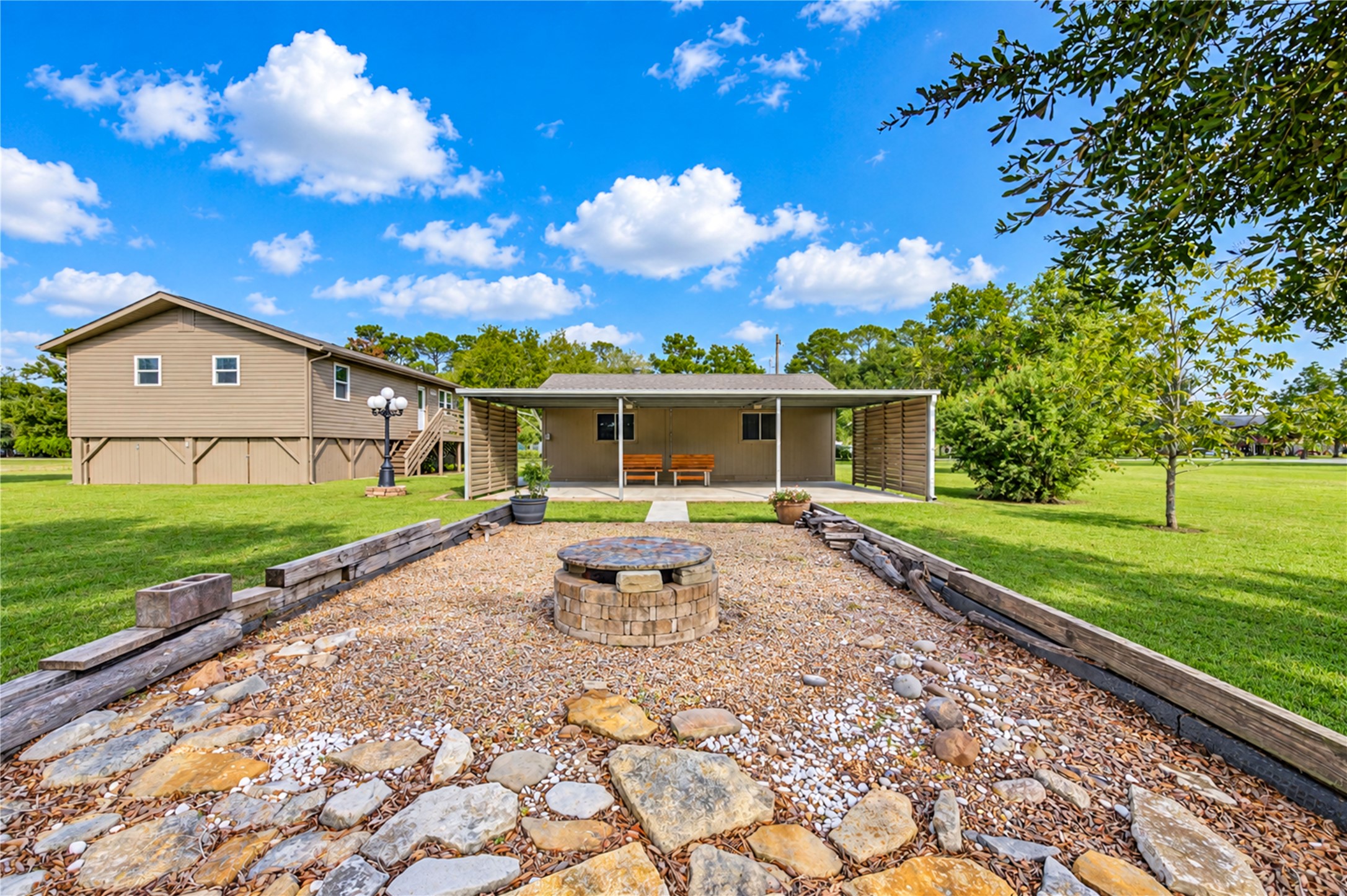 11605 Strom Road Dickinson, TX 77539 - Photo 29 of 41 Additional covered outdoor space with the carport extending from the rear of the garage