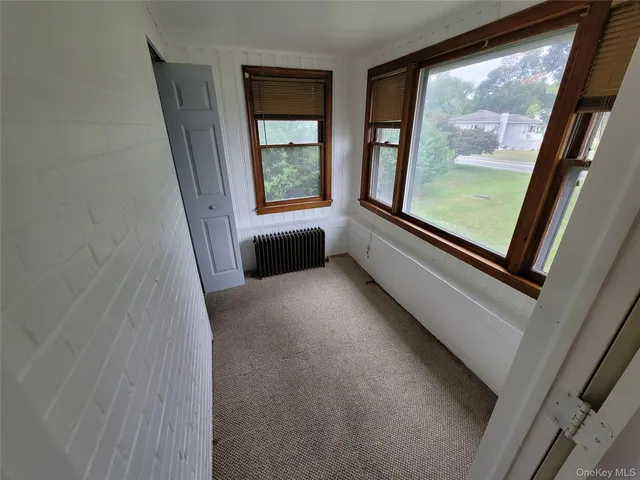 a view of a hallway with a large window