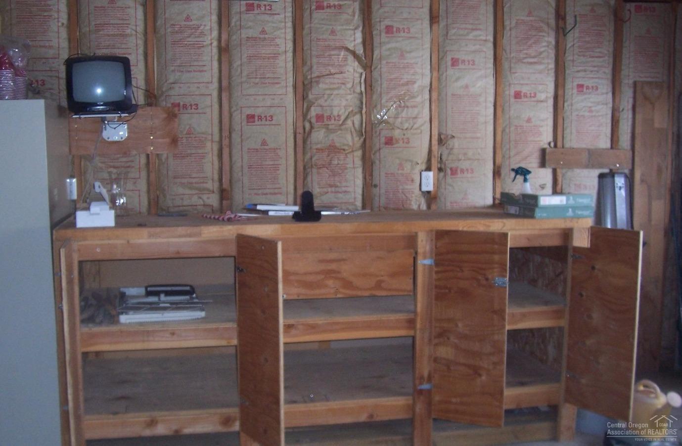 504 East Ridgeview Drive Culver, OR 97734 - Photo 7 of 7 Workbench and storage in garage