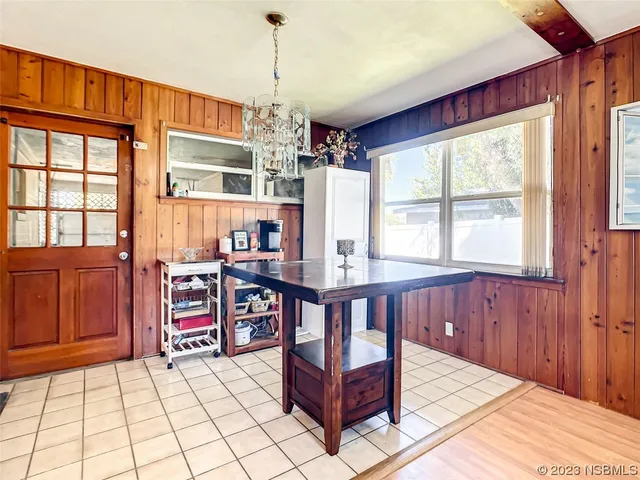a very nice looking bedroom with a large window