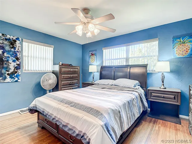 a bedroom with bed and window