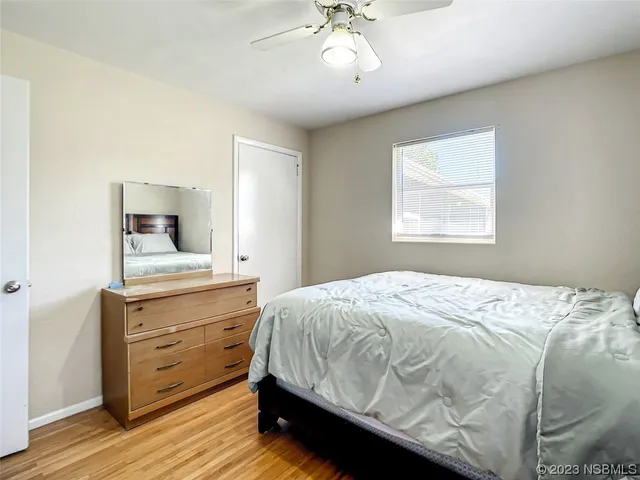 a bedroom with a large bed and a dresser