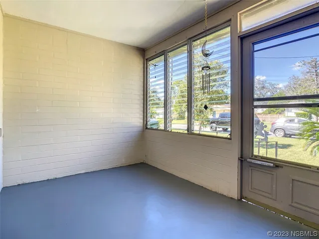 a view of an empty room and window