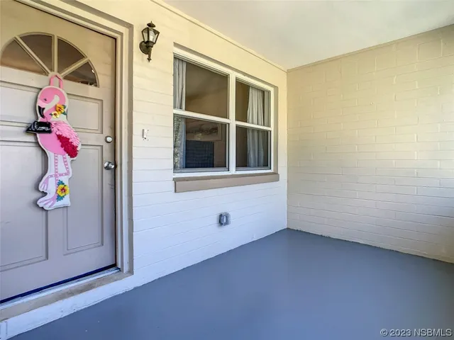 a view of an entryway with a small yard