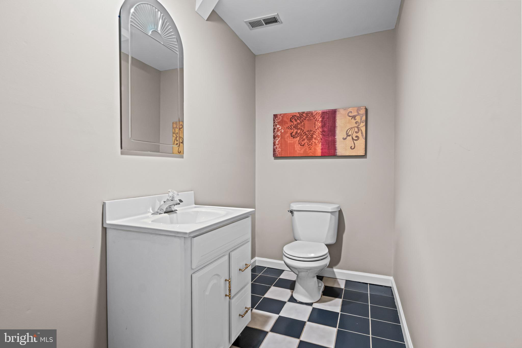 1720 Hampton Drive Jamison, PA 18929 - Photo 34 of 41 a bathroom with a toilet a sink and a mirror