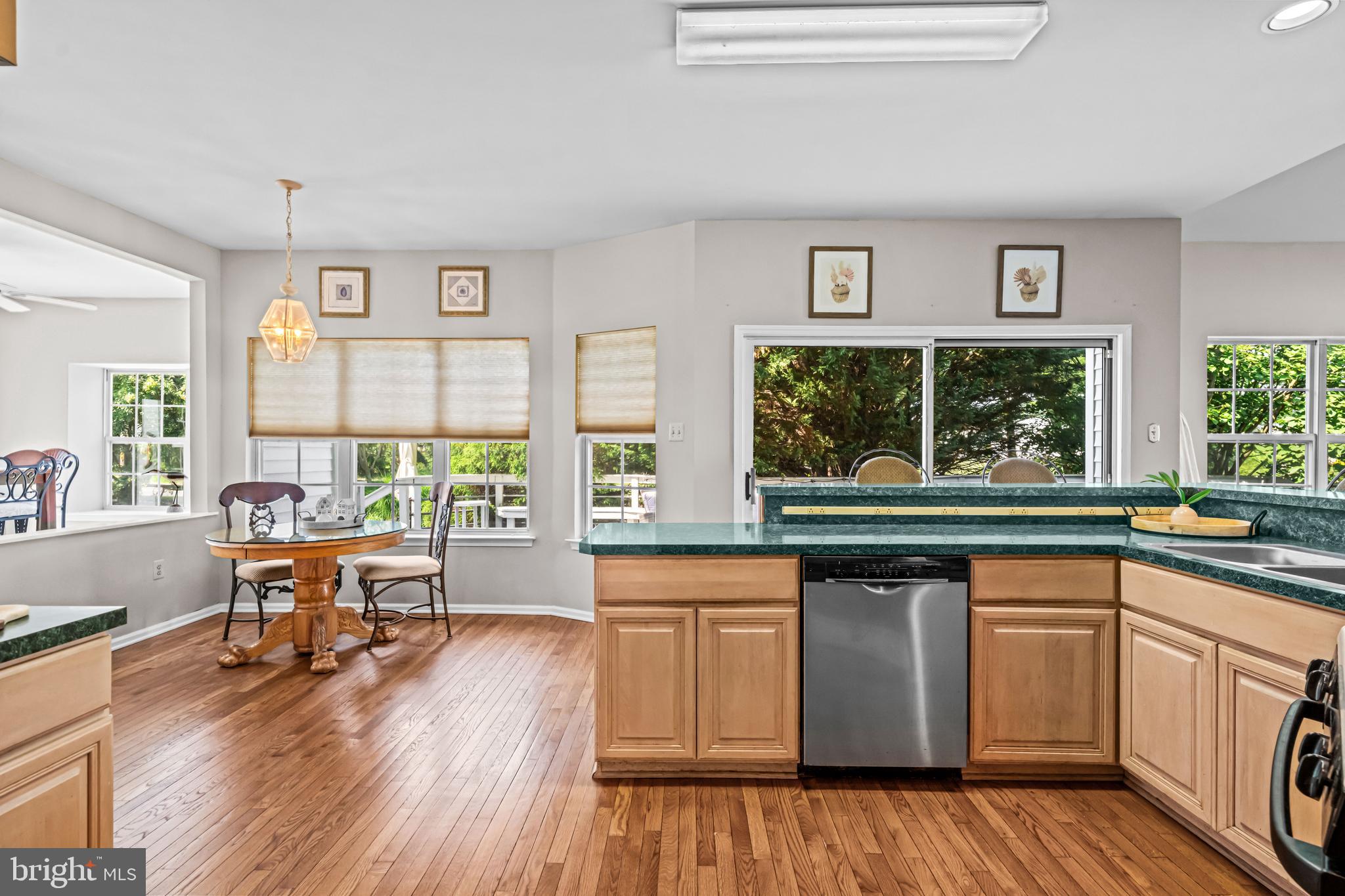 1720 Hampton Drive Jamison, PA 18929 - Photo 7 of 41 a kitchen with wooden floors and white cabinets