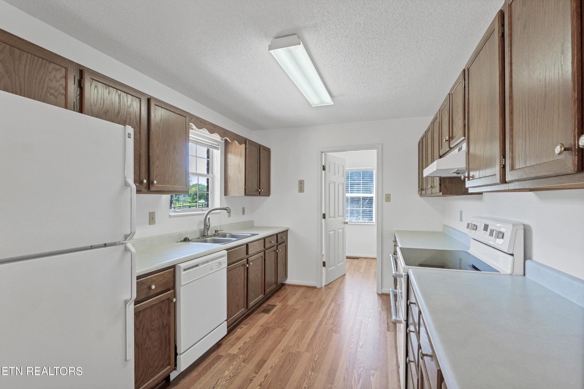 2036 Little Best Road Maryville, TN 37803 - Photo 8 of 54 a kitchen with a sink a counter top space stainless steel appliances and cabinets