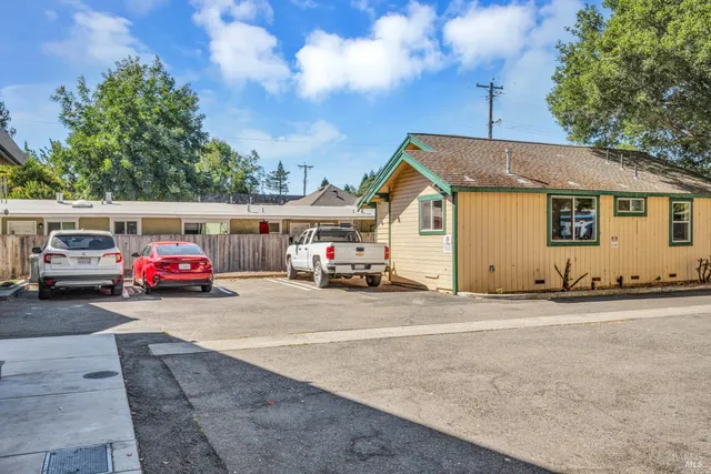 a view of a car parked in front of a house