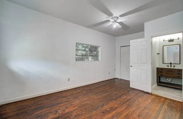 wooden floor in an empty room with a fireplace