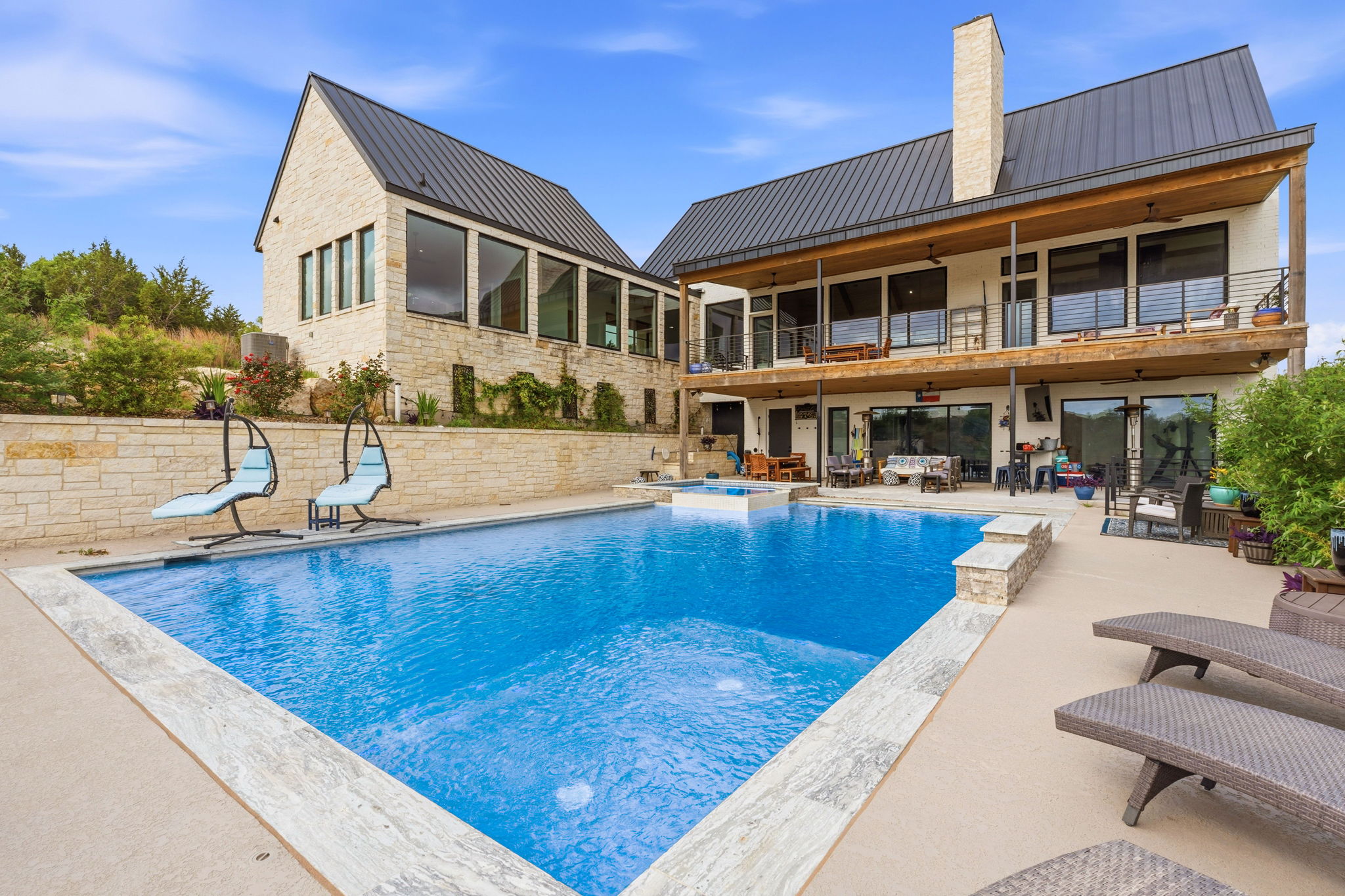 194 Placid Way Spring Branch, TX 78070 - Photo 33 of 37 Expansive outdoor living area featuring a rectangular swimming pool with integrated spa